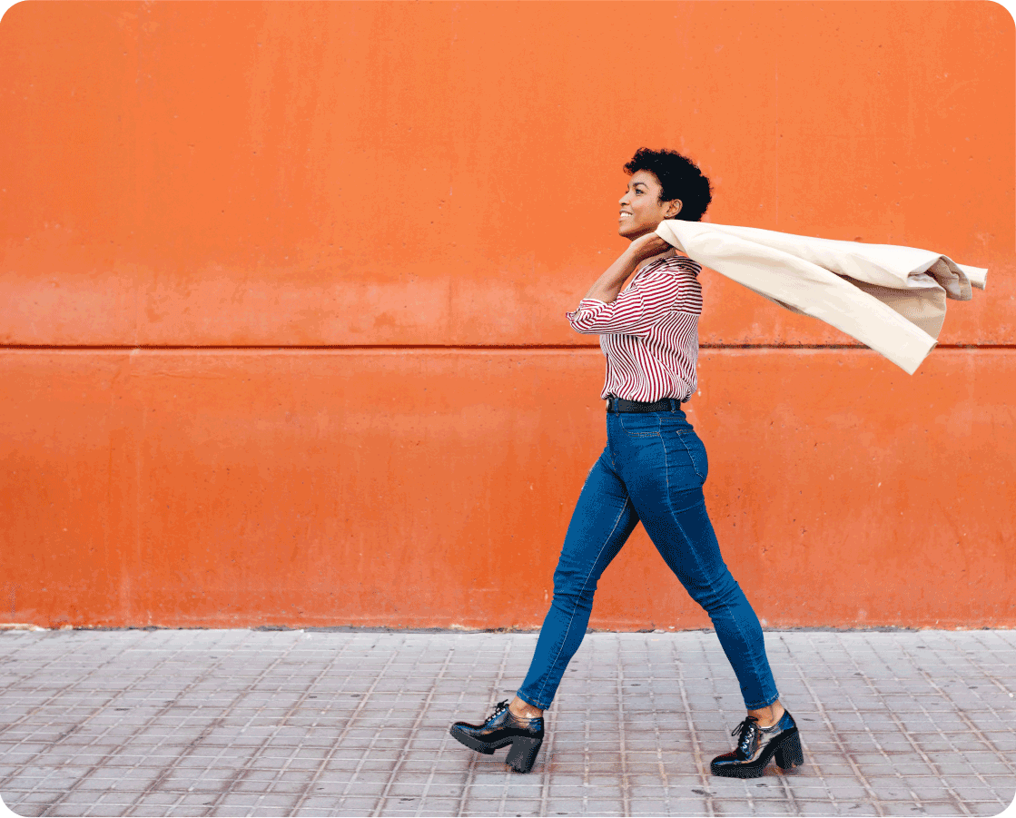 Fidelity Careers hero, woman walking with jacket