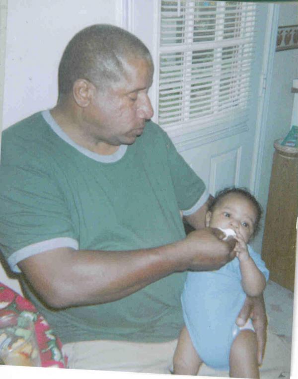 Grandpa feeding grandson