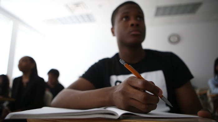 Which Atlanta school is pushing early college completion to tackle student debt?