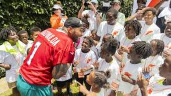 Tua Tagovailoa Helping Kids With Backpacks And Supplies 